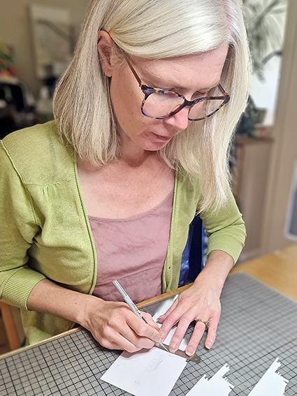 Artist Kate Hipkiss working in her studio